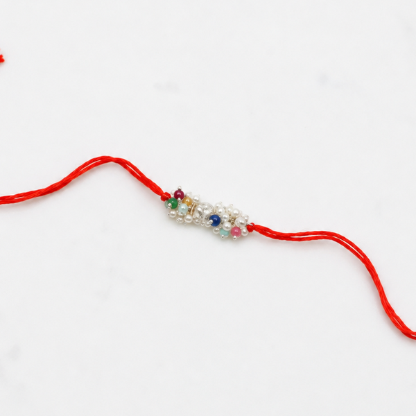Close-up of Silver Bead & Multicolour Stone Bunch Rakhi craftsmanship