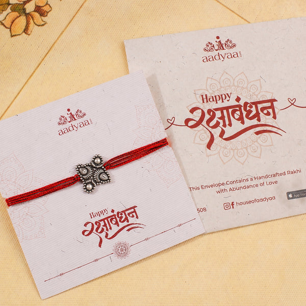 Handcrafted Silver Rakhi/Pendant: Chandrakor & Drop Motif