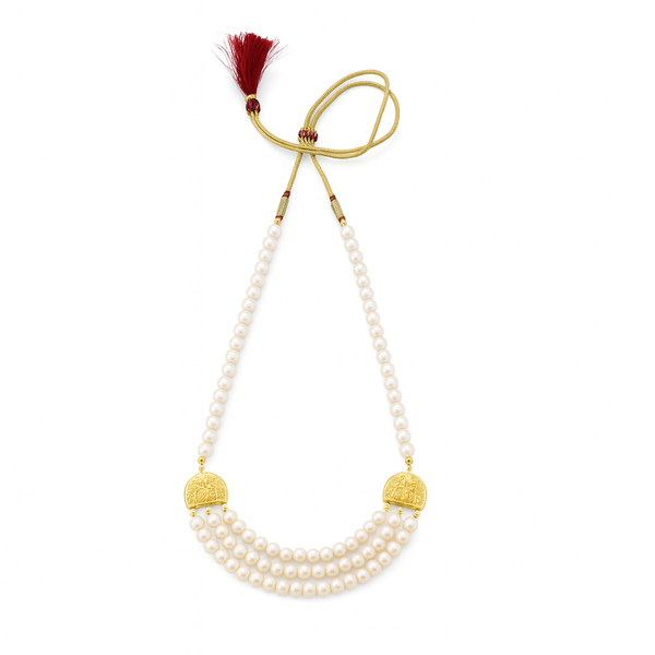 Elegant pearl necklace with gold accents and red tassel