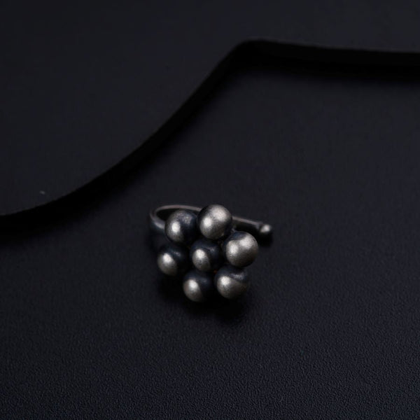 a bunch of balls sitting on top of a black surface