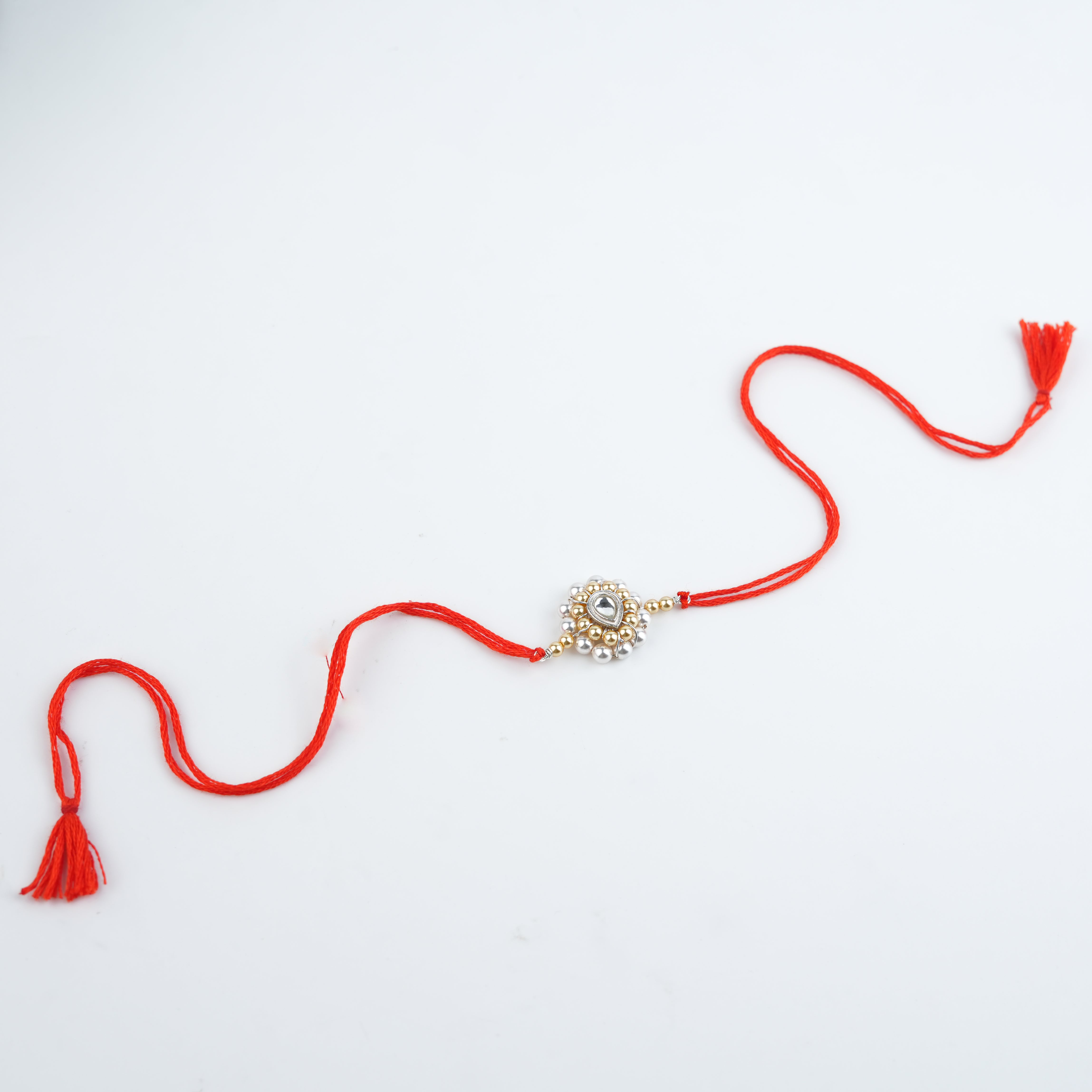 CZ Drop, Golden & White Pearl Handmade Silver Rakhi