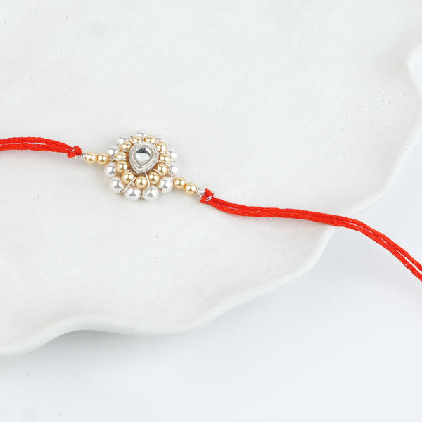 CZ Drop, Golden & White Pearl Handmade Silver Rakhi