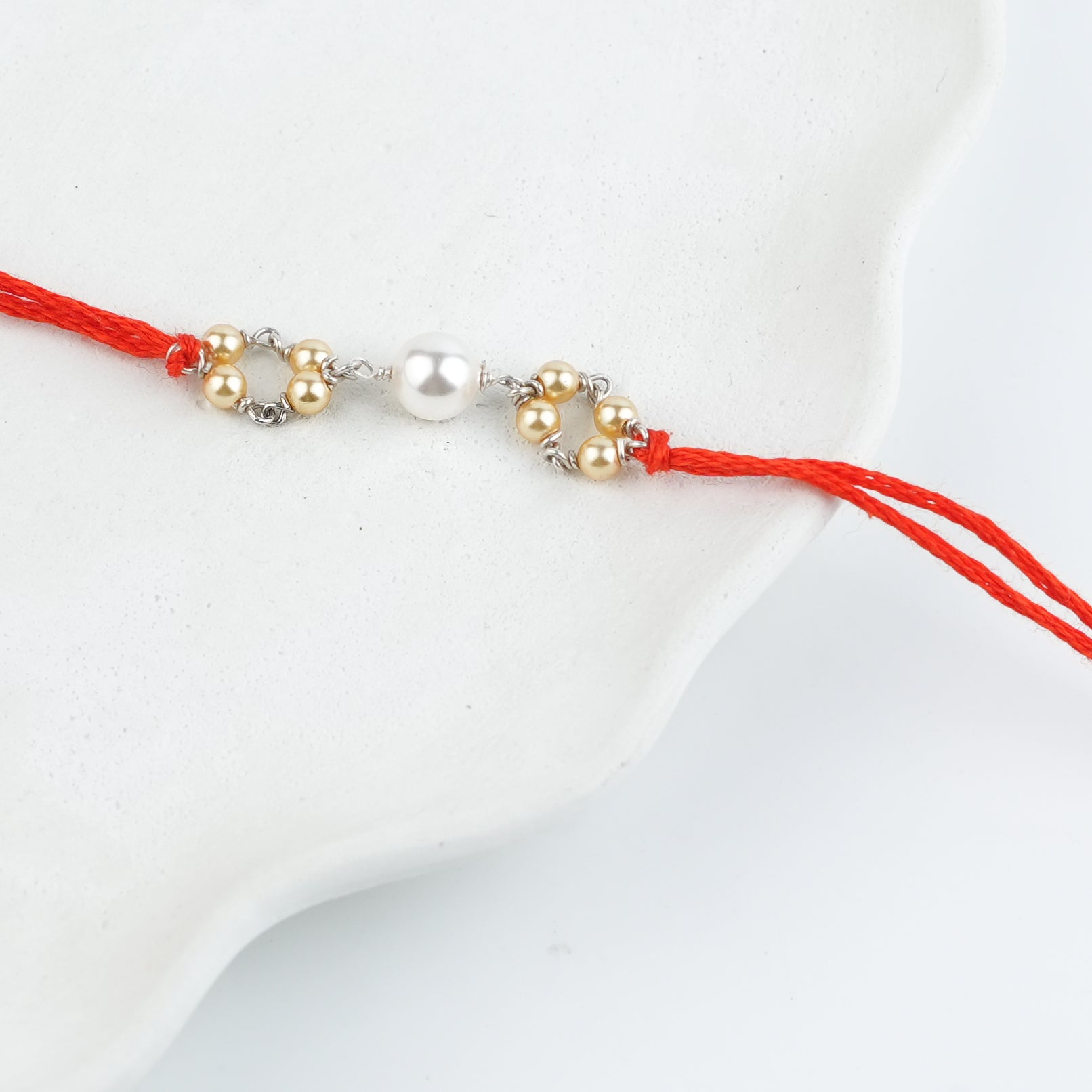 Golden & White Pearl Handmade Silver Rakhi