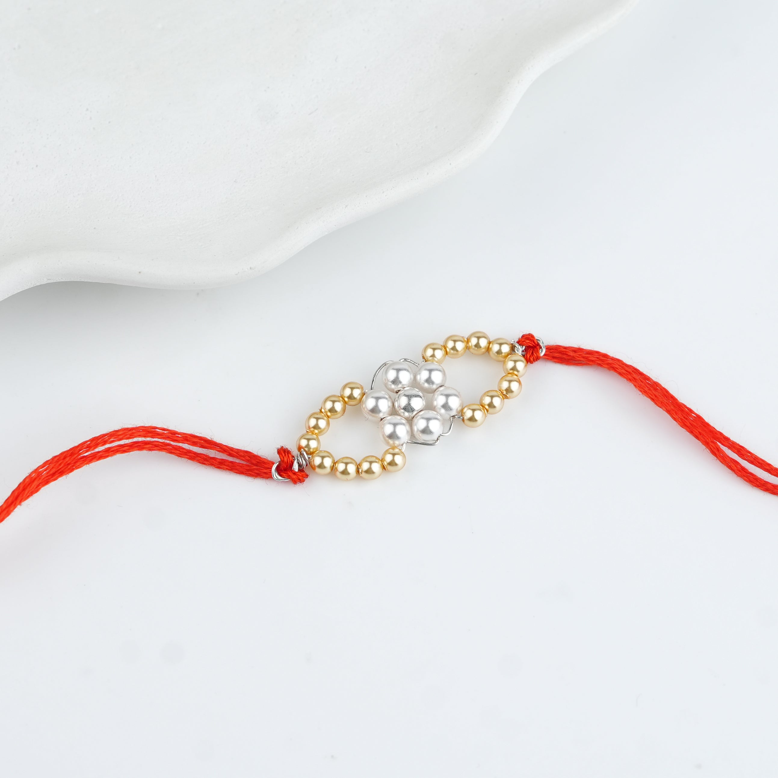 Golden & White Pearl Handmade Silver Rakhi
