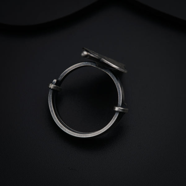 a close up of a ring on a black surface