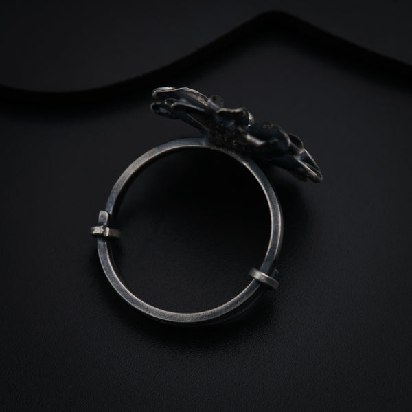 a silver ring with a horse head on it