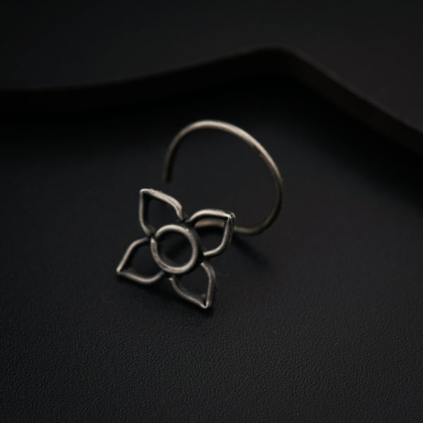 a metal ring with a flower on it
