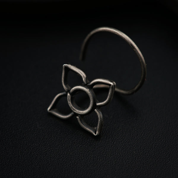 a close up of a metal object on a black surface