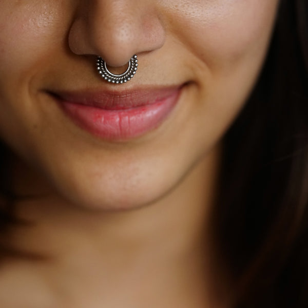 Silver dotted septum ring detailing