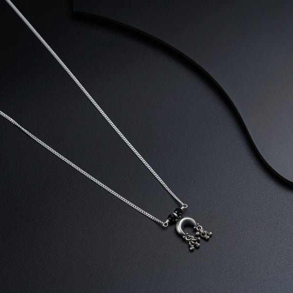 a couple of necklaces sitting on top of a table