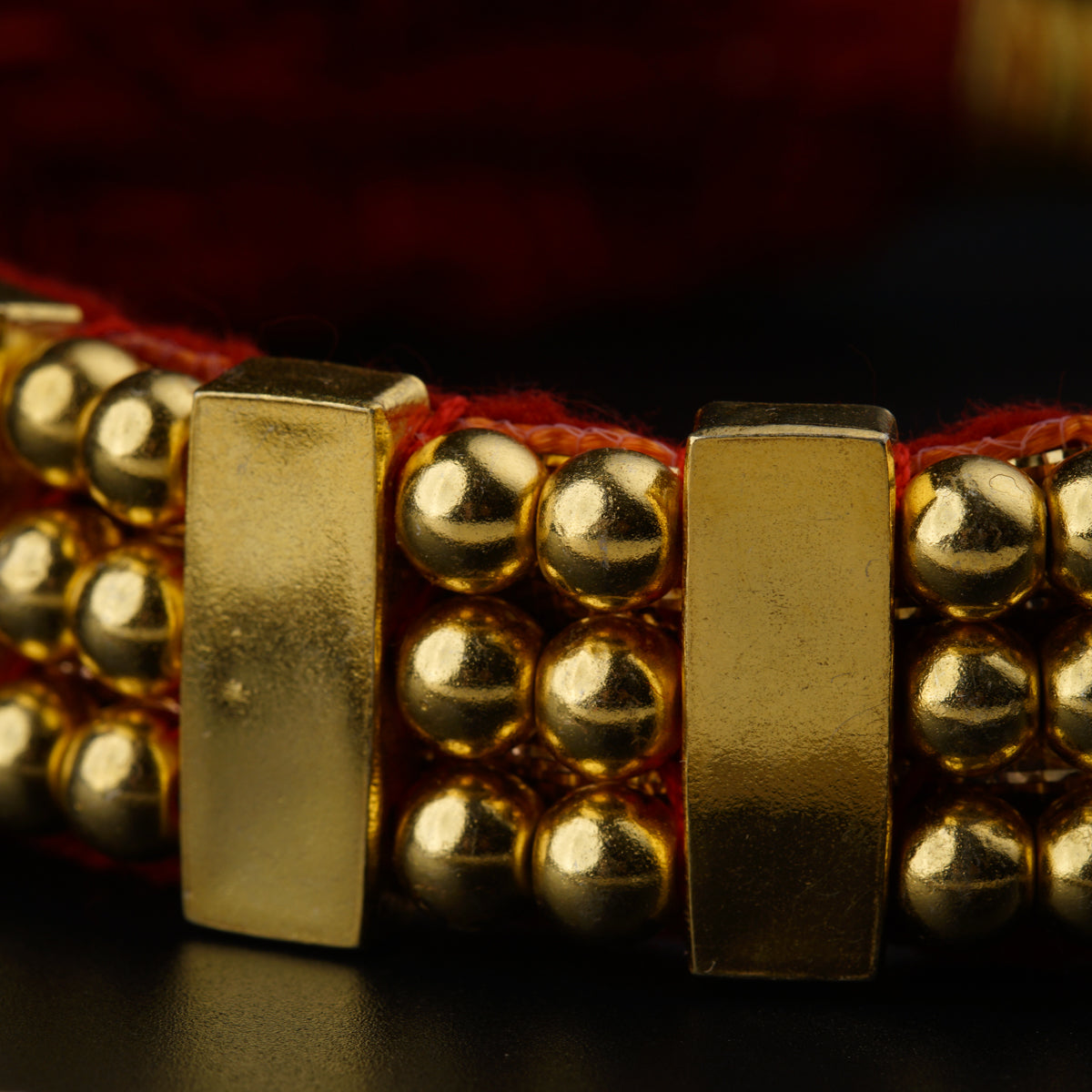 a close up of a gold bracelet on a table