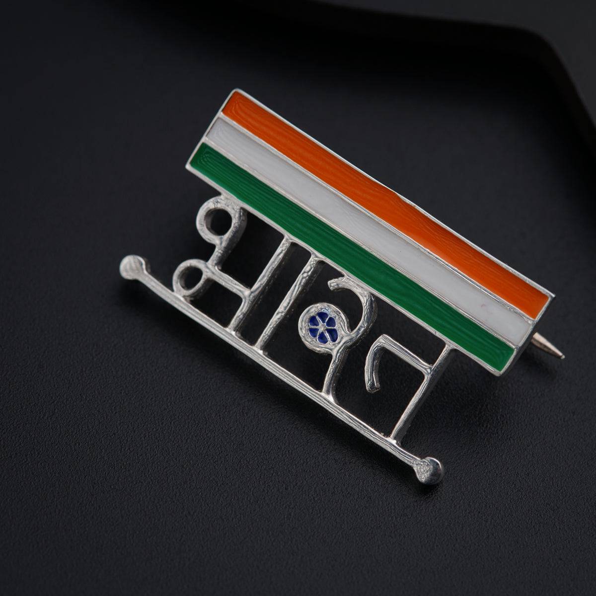 a pin with the word india on it