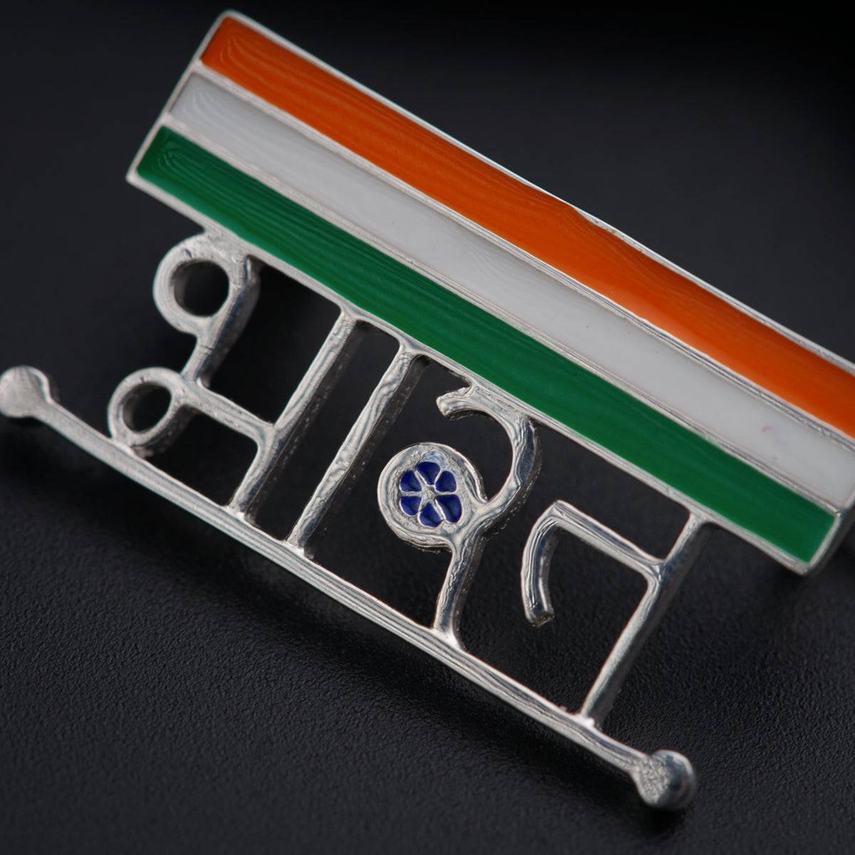 a lapel badge with the word india on it