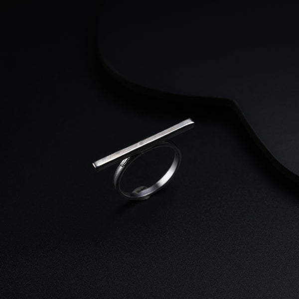 a close up of a ring on a black surface