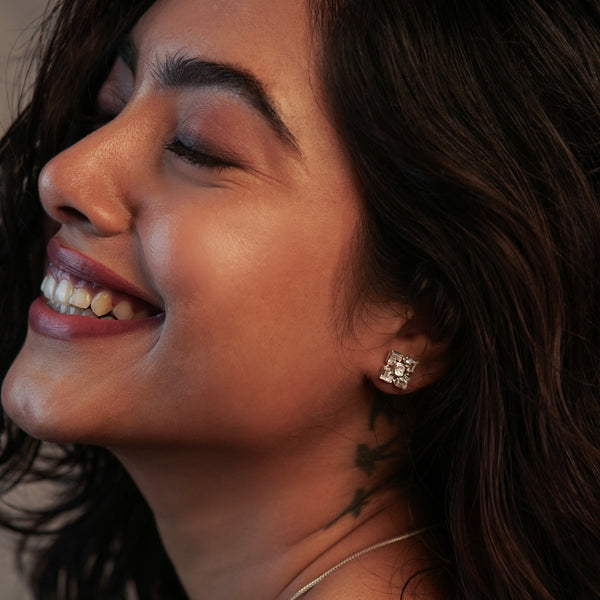 Woman with earrings and necklace showcasing jewelry sets