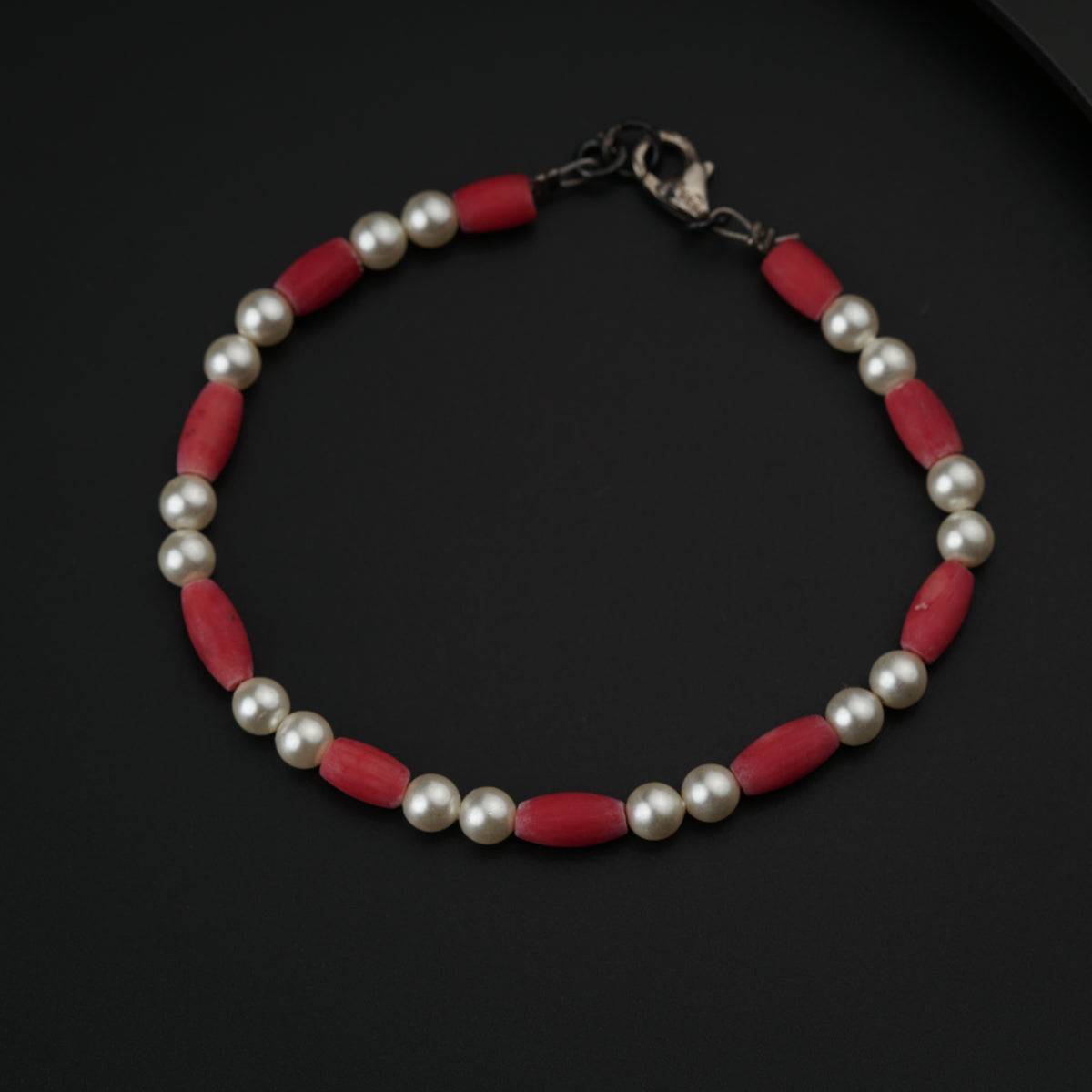 Semi precious stone bracelet in silver wire ( Coral and Pearls )