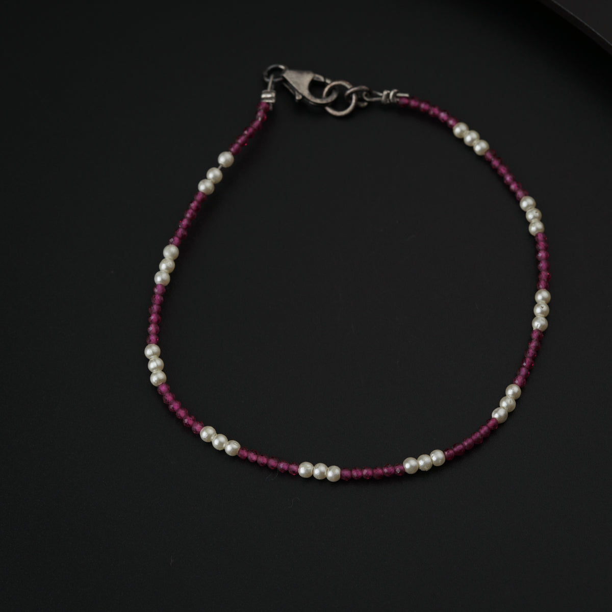 Semi precious stone bracelet in silver wire ( Lab made rubies and pearls )