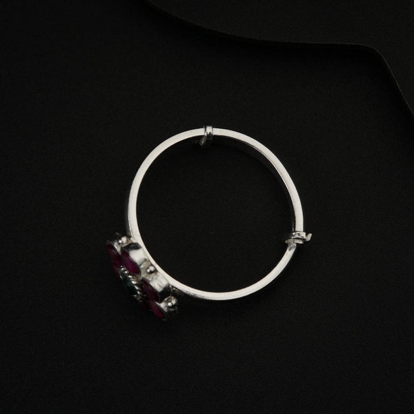 Silver ring with red gemstone accents