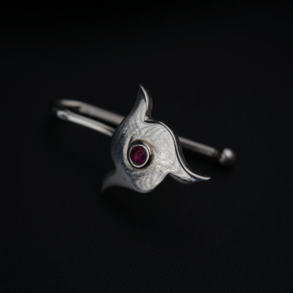 a close up of a ring on a black surface