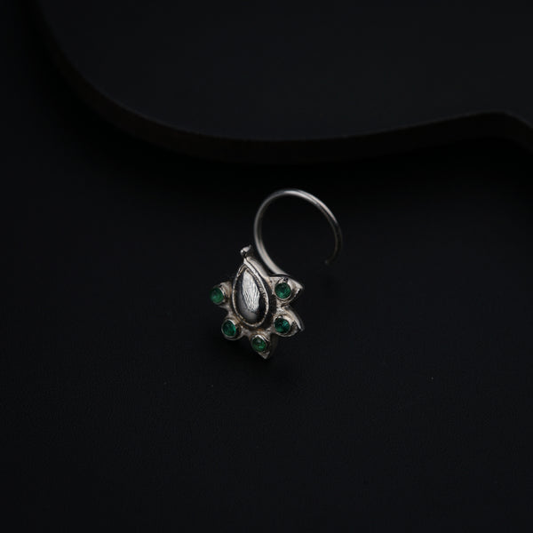 a close up of a ring on a black surface