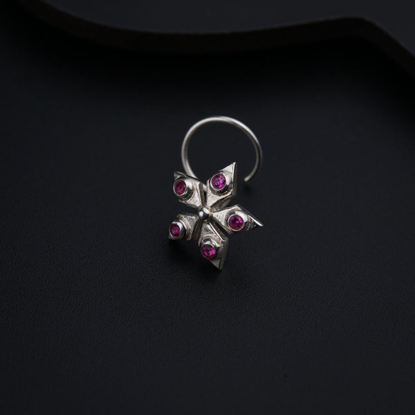 a close up of a ring on a black surface