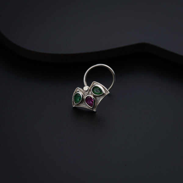 a close up of a ring on a black surface