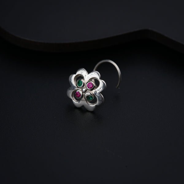 a close up of a ring on a black surface