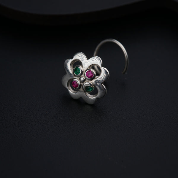 a close up of a ring on a black surface