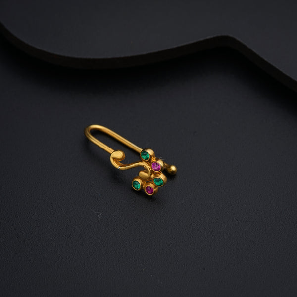 a pair of gold earrings with multi - colored stones