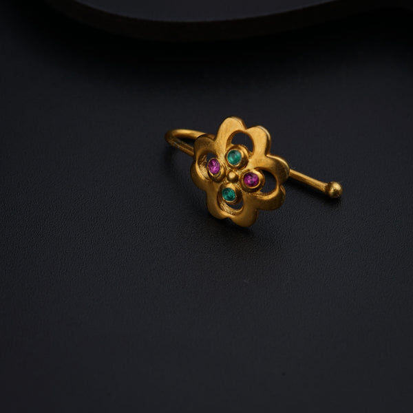 a close up of a ring on a black surface