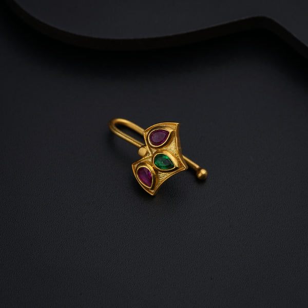 a close up of a ring on a black surface