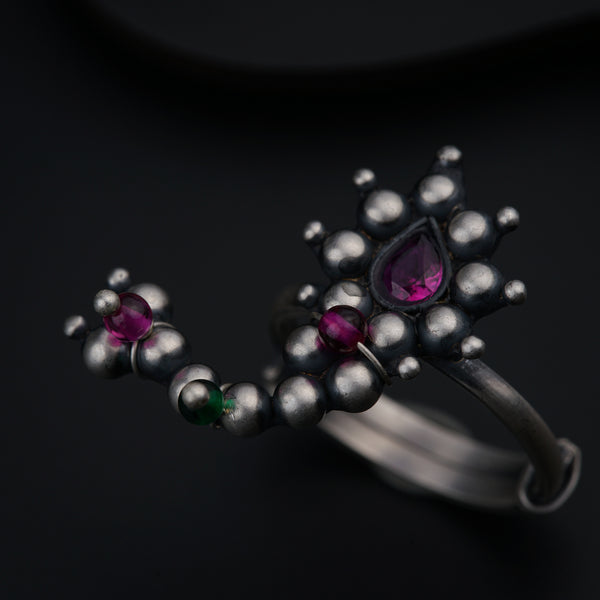 a close up of a ring on a black surface