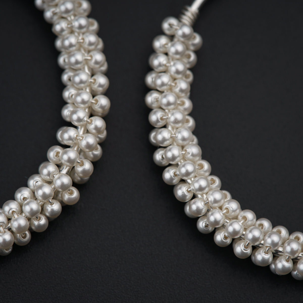 a close up of a pair of pearls
