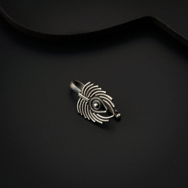 a close up of a ring on a black surface
