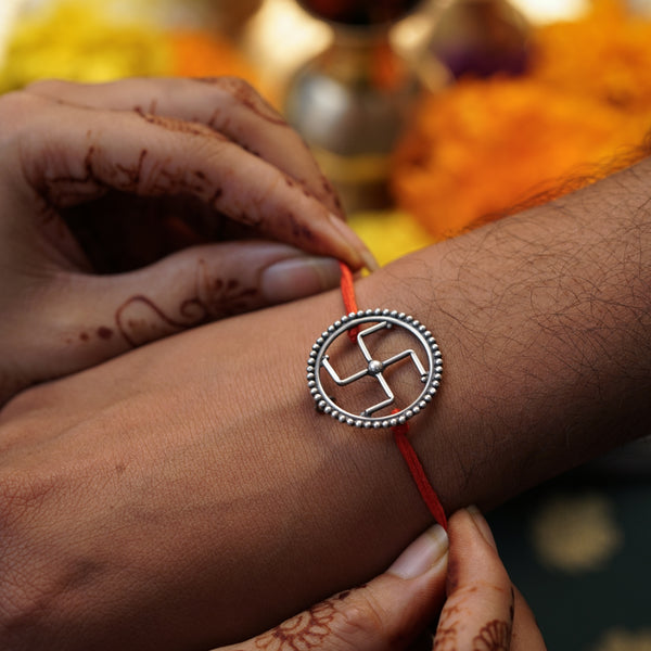 Handcrafted Silver Rakhi/Pendant: Swastik