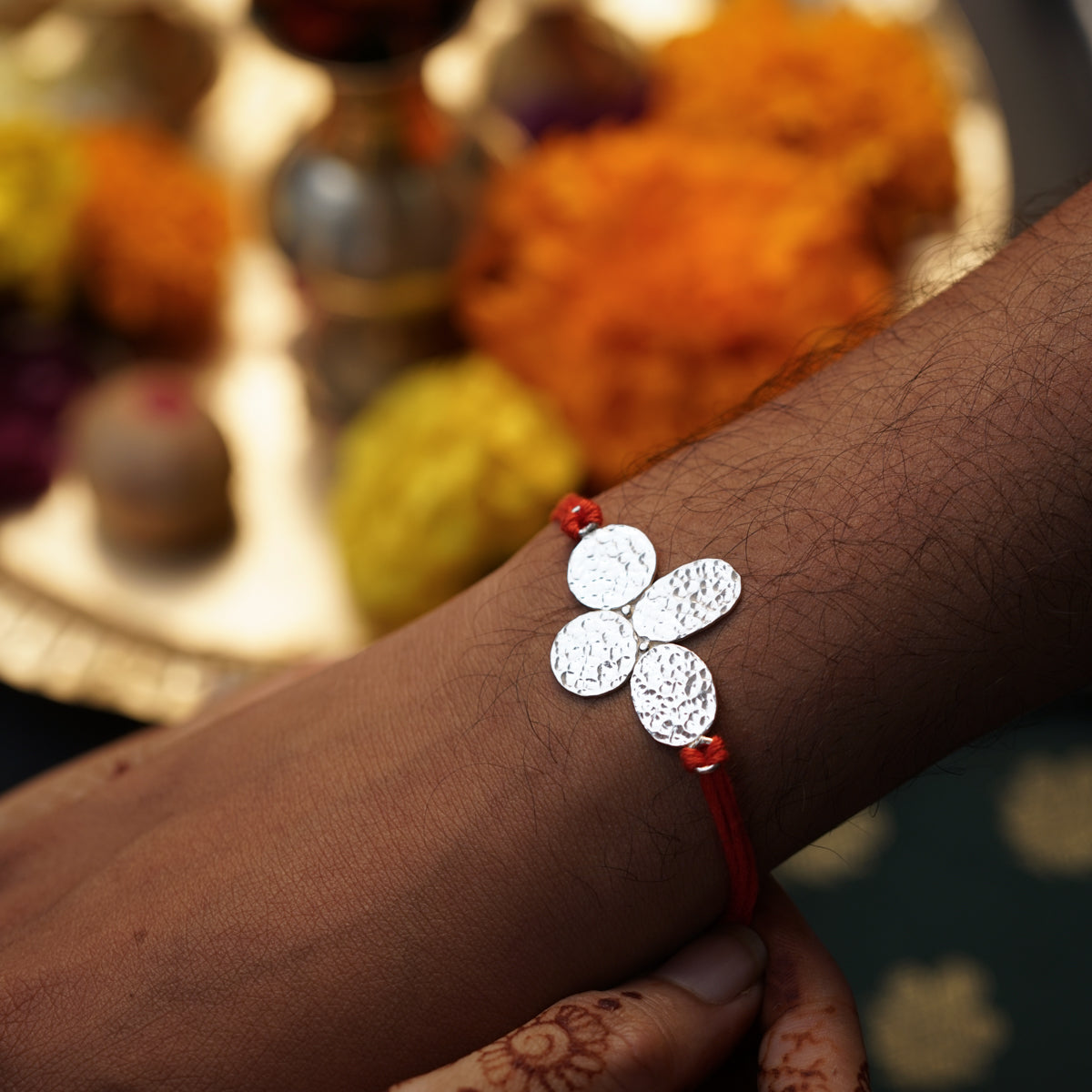 Silver Hammered Flower Rakhi