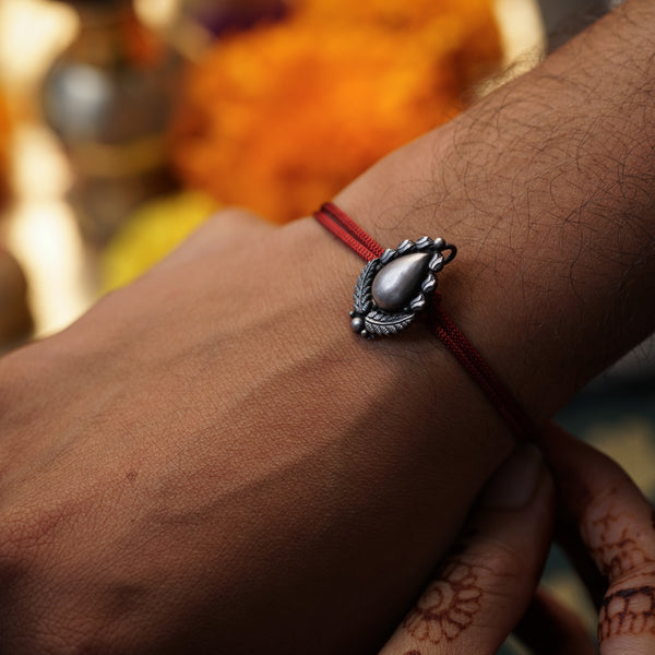 Handcrafted Silver Rakhi/Pendant: Drop