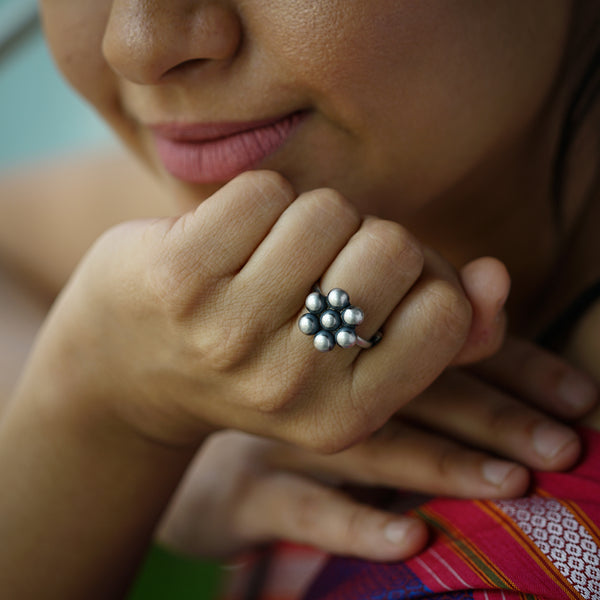 a close up of a person wearing a ring
