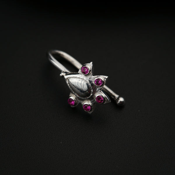 a close up of a ring on a black surface