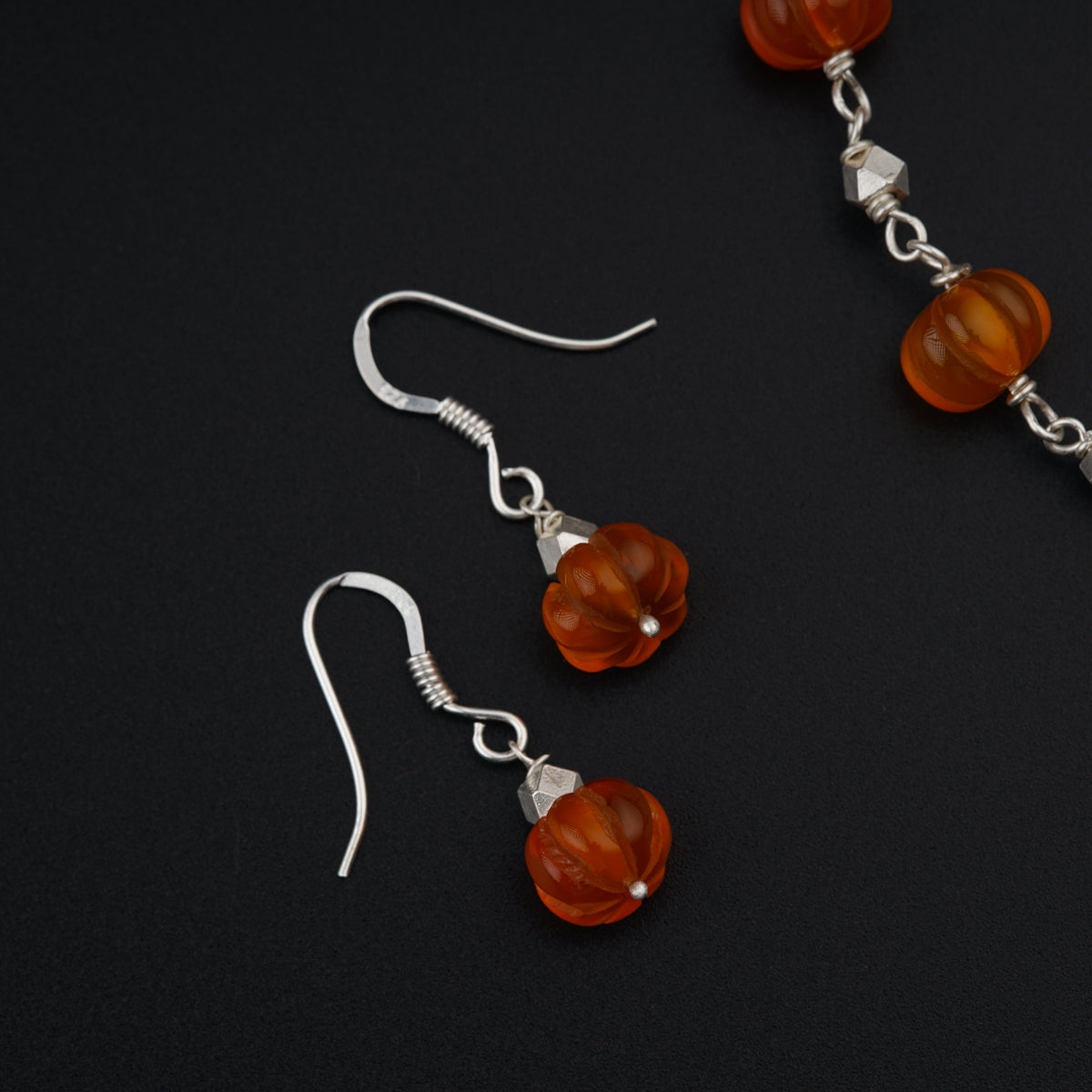 Silver set with carved Carnelian stones