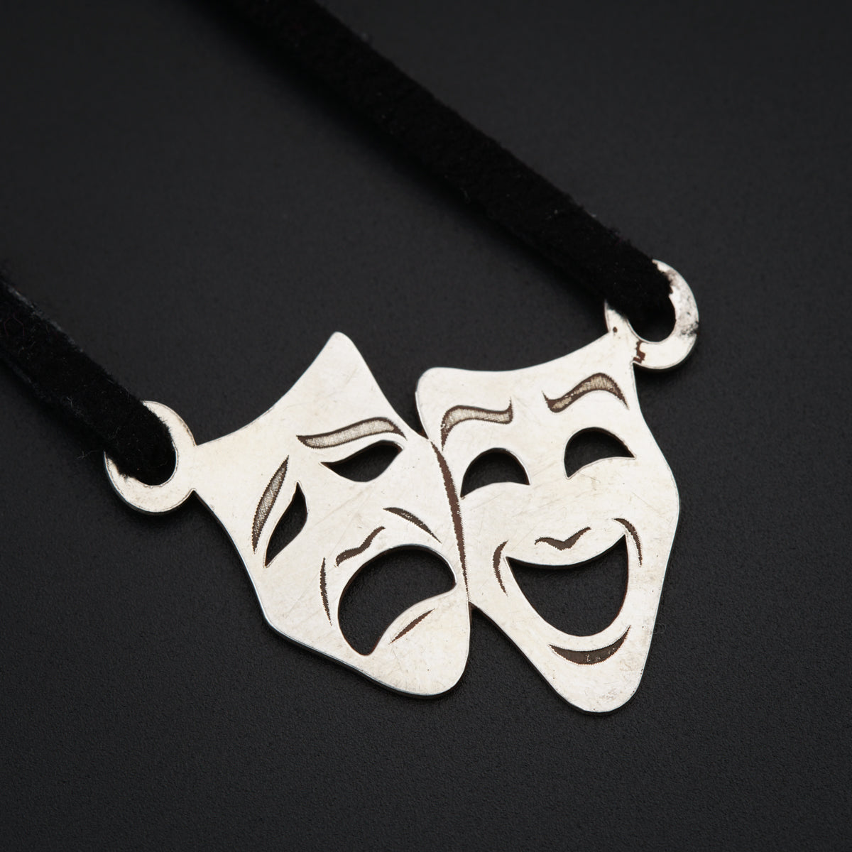 a couple of masks on a black cord