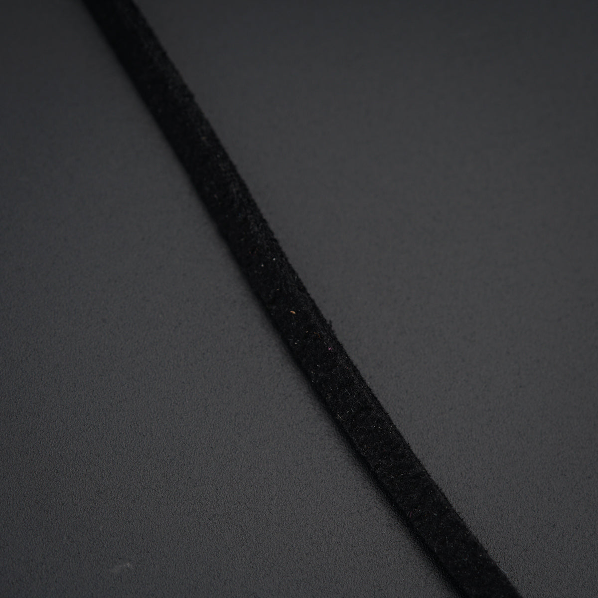 a close up of a black cord on a table