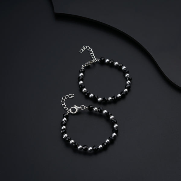 a couple of bracelets sitting on top of a table