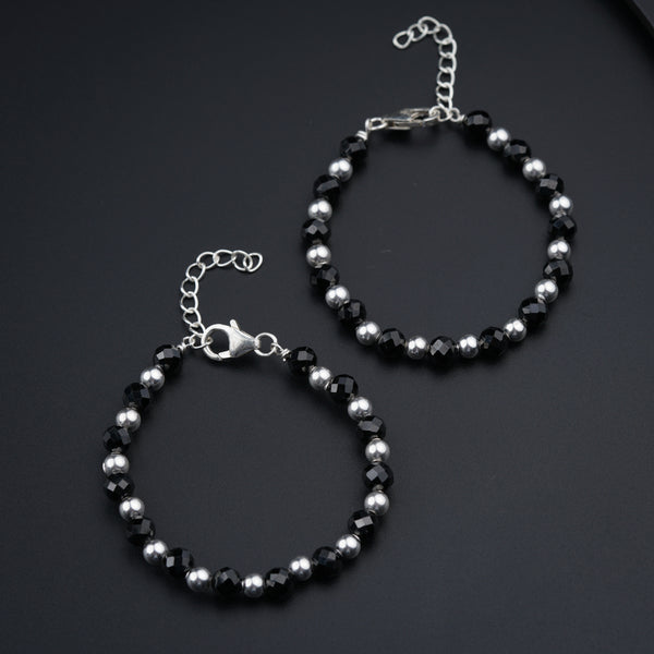 a couple of bracelets sitting on top of a table
