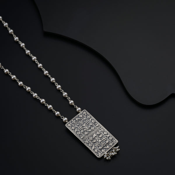 a couple of necklaces sitting on top of a table
