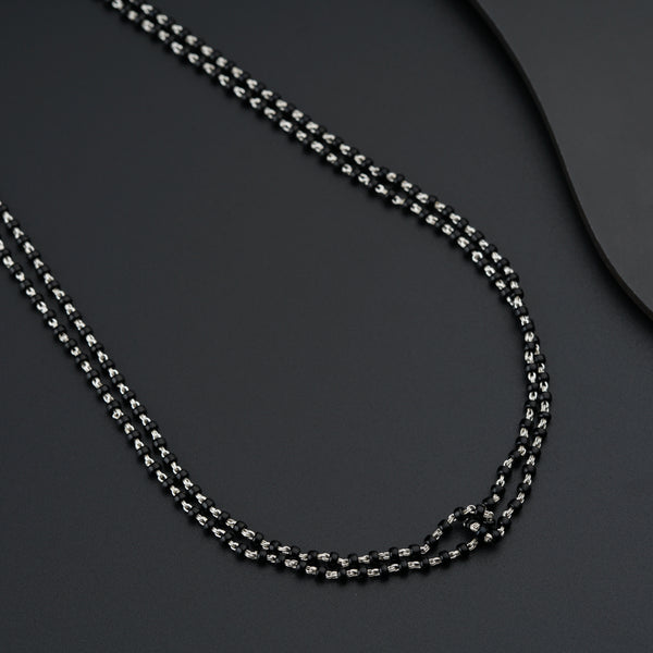 a close up of a necklace on a table