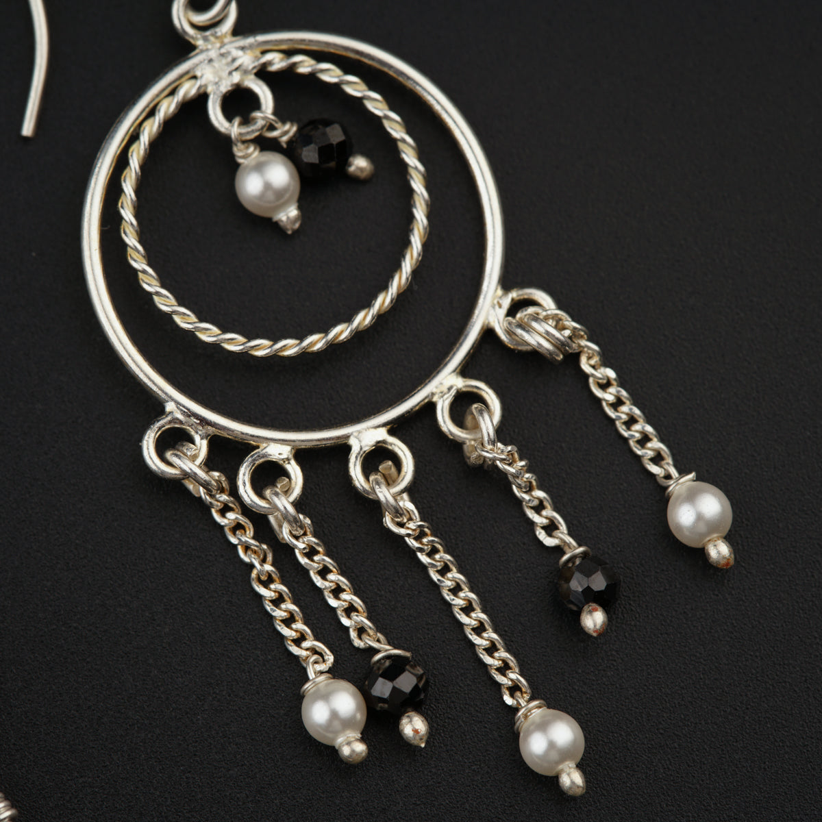 a close up of a pair of hoop earrings