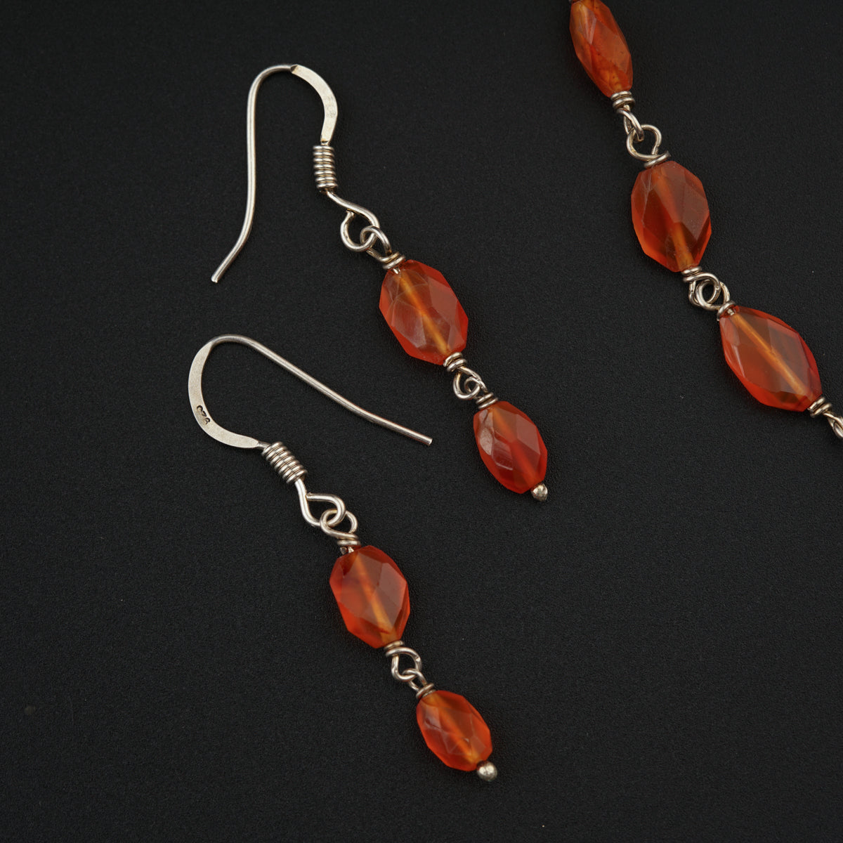 a pair of red glass beaded earrings