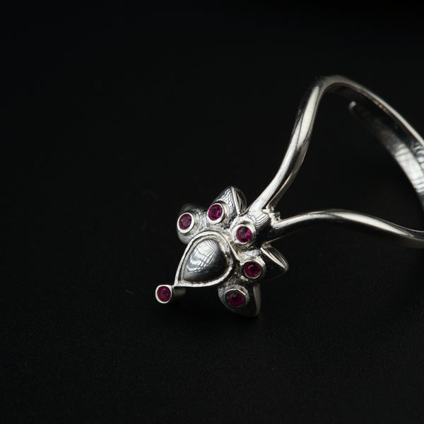 a close up of a ring on a black surface