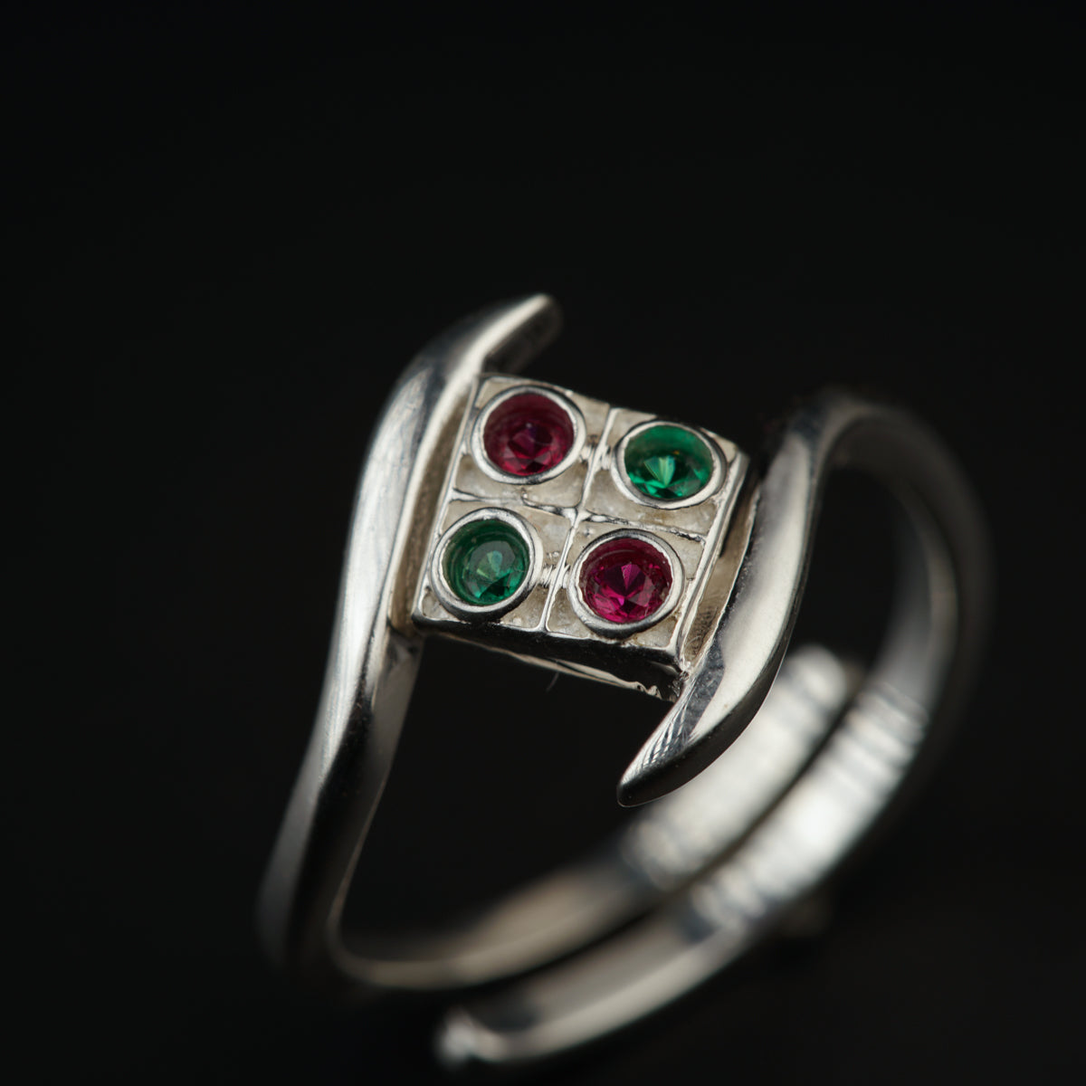 a close up of a ring on a black background